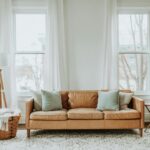 A cozy minimalist living room with a leather sofa and stylish decor.